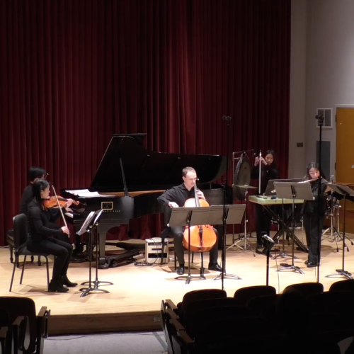 Three Modern Music Ensemble students performing on stage