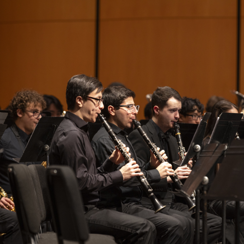 Students in the University of Washington School of Music's Wind Ensemble performing on stage (Photo: UW Photography).