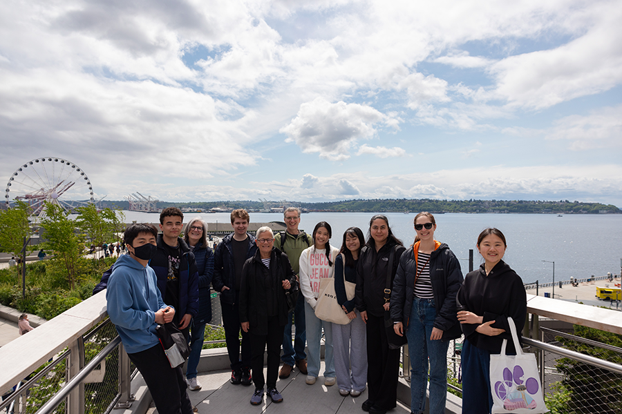 The Curiosity Clinic participants pose in front of the Seattle waterfront.