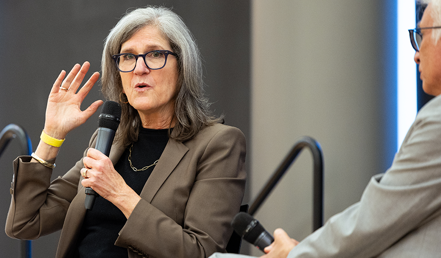 Dean Harris speaks onstage with David Staley.