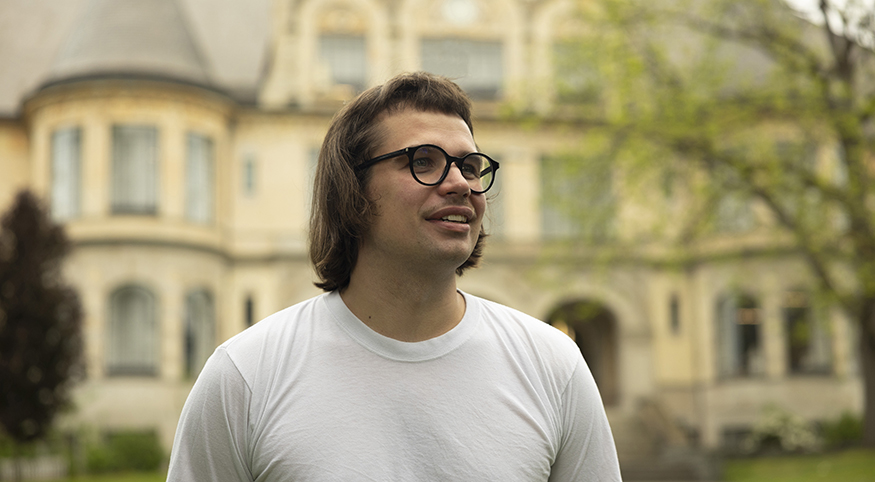Greg Rahuoja on the UW campus, with Denny Hall in the background.