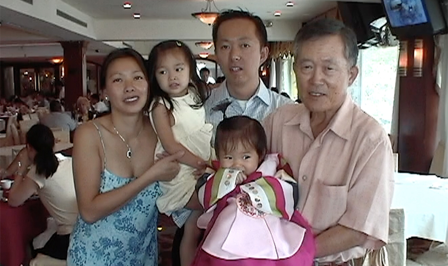 Hunter Jung as a baby, with her parents, grandfather, and sister.