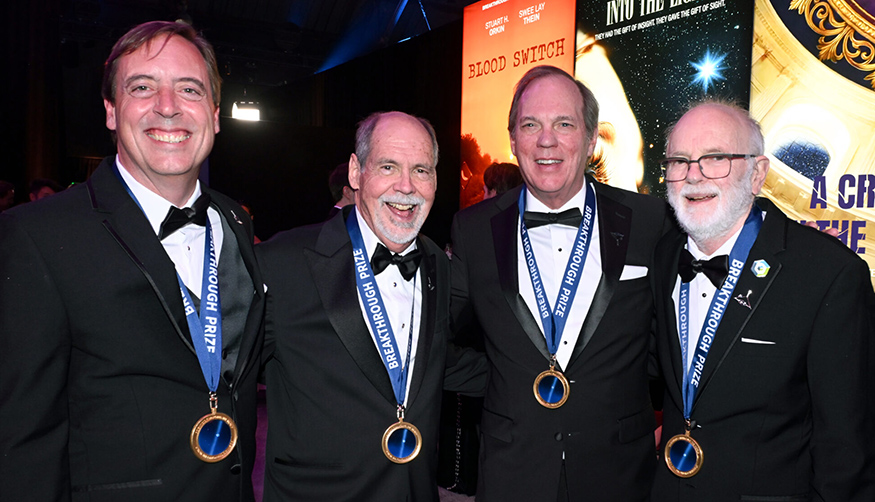 Breakthrough Prize team (four people) wearing their medals 
