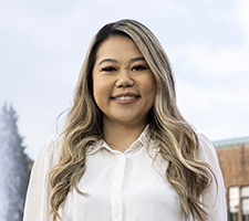 Jennifer Sheng standing near Drumheller Fountain on the UW campus. 
