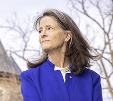 Nobel laureate Mary Brunkow standing outside on the UW campus.