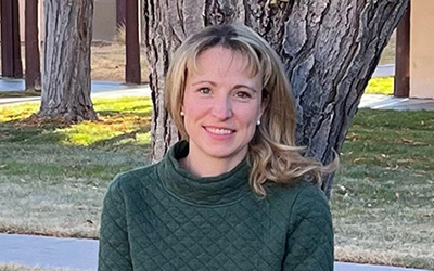 Tessa Olmstead with a tree in the background.