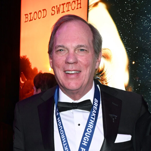 David Hertzog with medal around his neck at Breakthrough Prize celebration event.