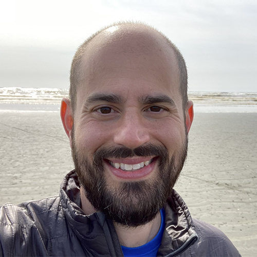 David Masiello with ocean shoreline behind him. 