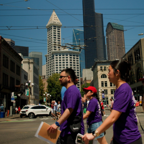 Arts & Sciences students Lucas Mejia, Marissa Martinez Agustin, and Demi Clark walk by Pioneer Square during a World Cup match day in Seattle