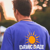 Student wears shirt with Dawg Daze logo on the back