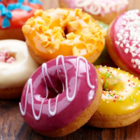 Donuts sit on top of a table