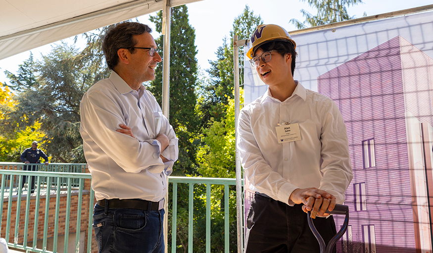 Govenor Bob Ferguson and UW Chemistry student Alan Zhan chat at the groundbreaking for the Chemical Sciences Building.