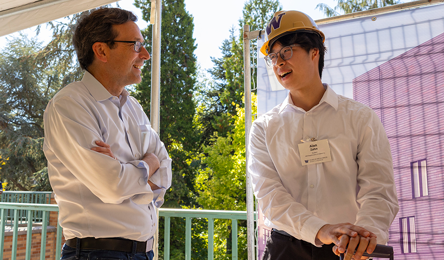 Governor Bob Ferguson and UW Chemistry student Alan Zhan chat at the groundbreaking for the Chemical Sciences Building.