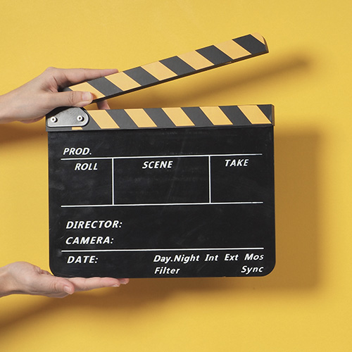 hands holding a film slate